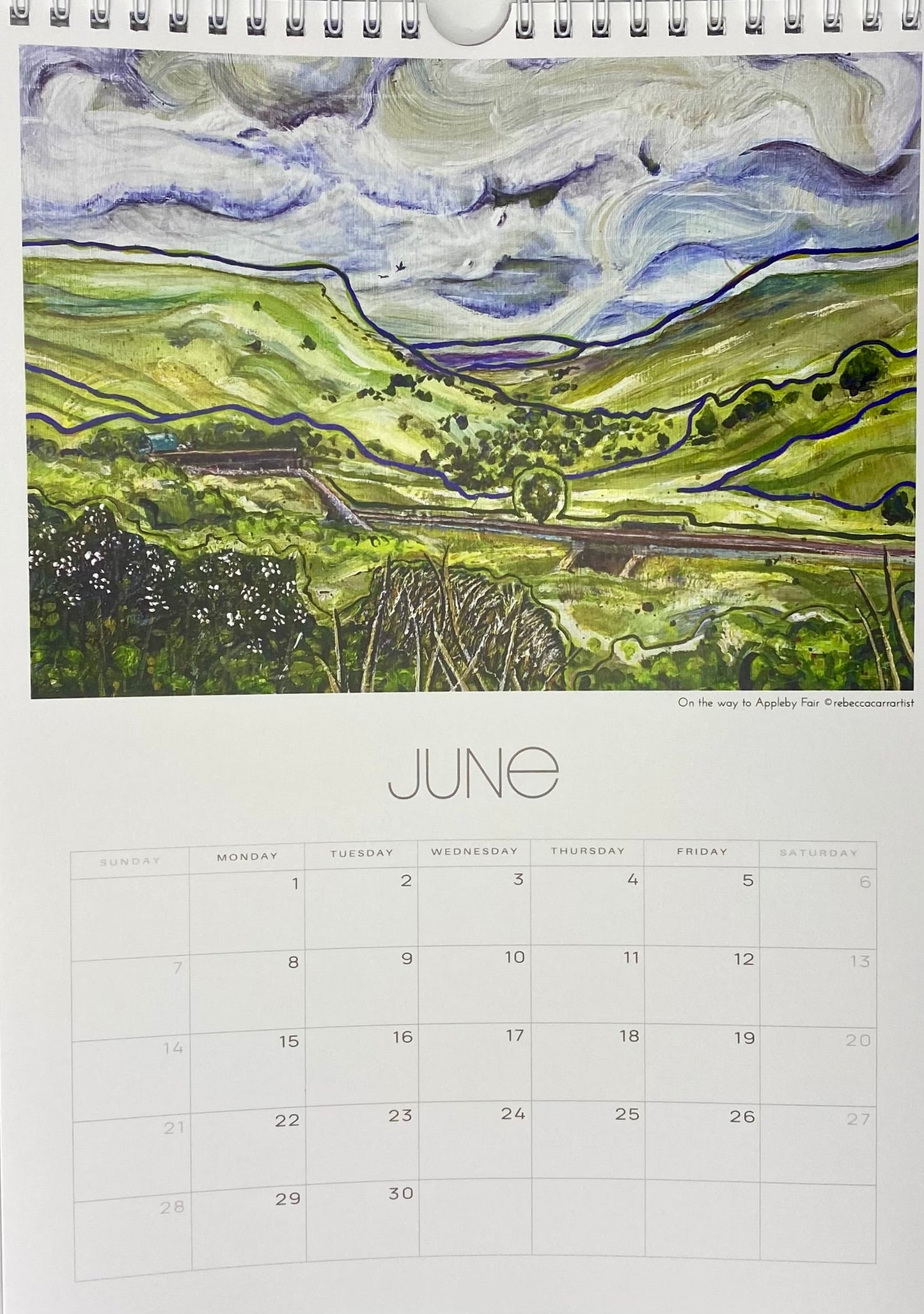 Calendar page for June with a eden valley landscape illustration on a white background