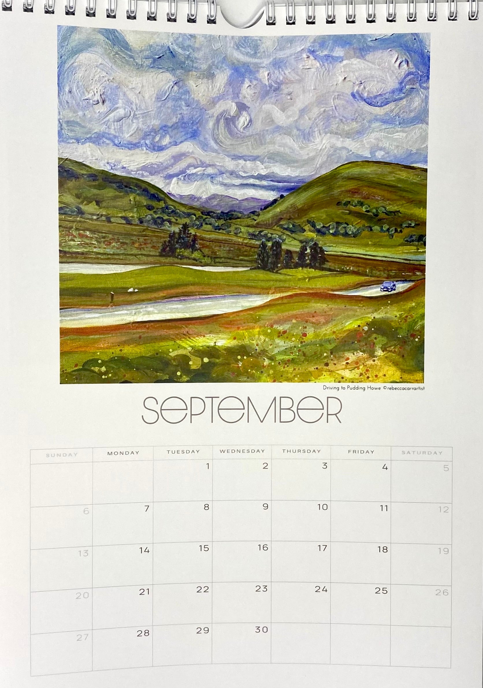 Calendar page for September with a landscape painting cover cumbria yorkshire