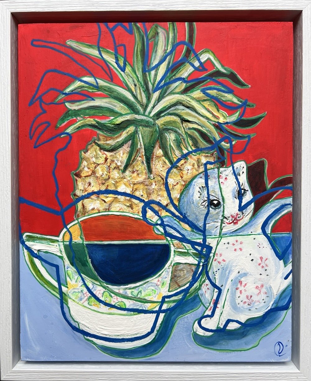 An abstract still life painting featuring a pineapple, a white cat, and teacups on a red and blue background, housed in a white wooden frame.