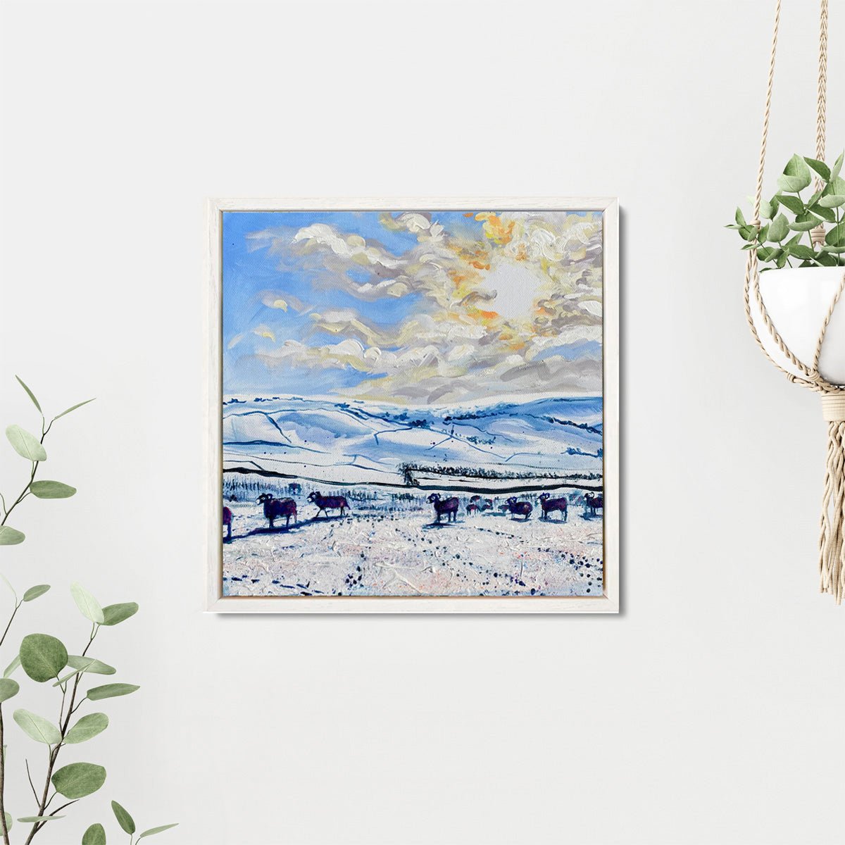 Original winter landscape painting of sheep walking across a snowy field under bright sunlight, with crisp snow textures, blue tones, and splashes of colour; mixed media on canvas, 30 x 30 cm, framed